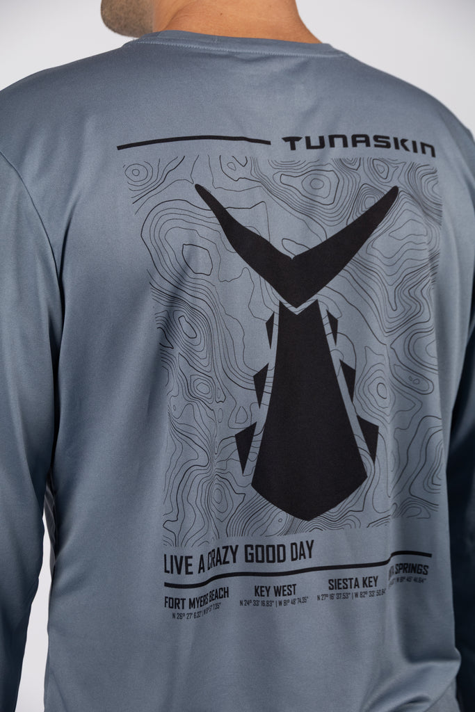 close up of tunaskin top design on back of charcoal long sleeve shirt