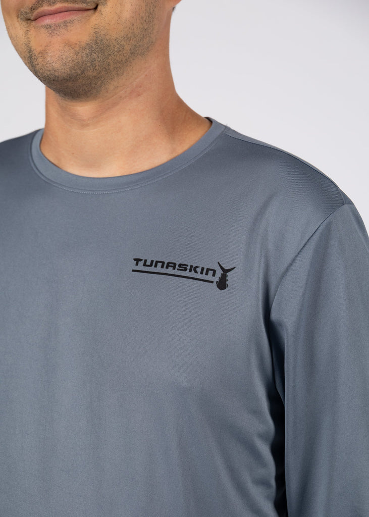 close up of left chest tunaskin logo on charcoal long sleeve shirt
