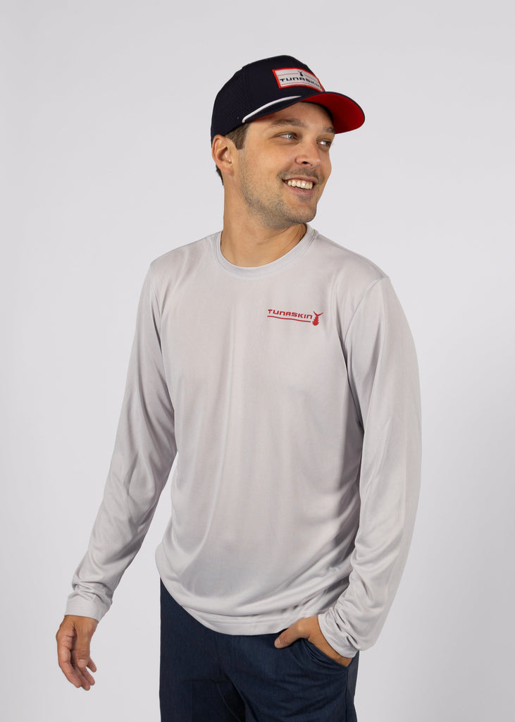 model wearing men's long sleeve silver shirt with left chest red logo