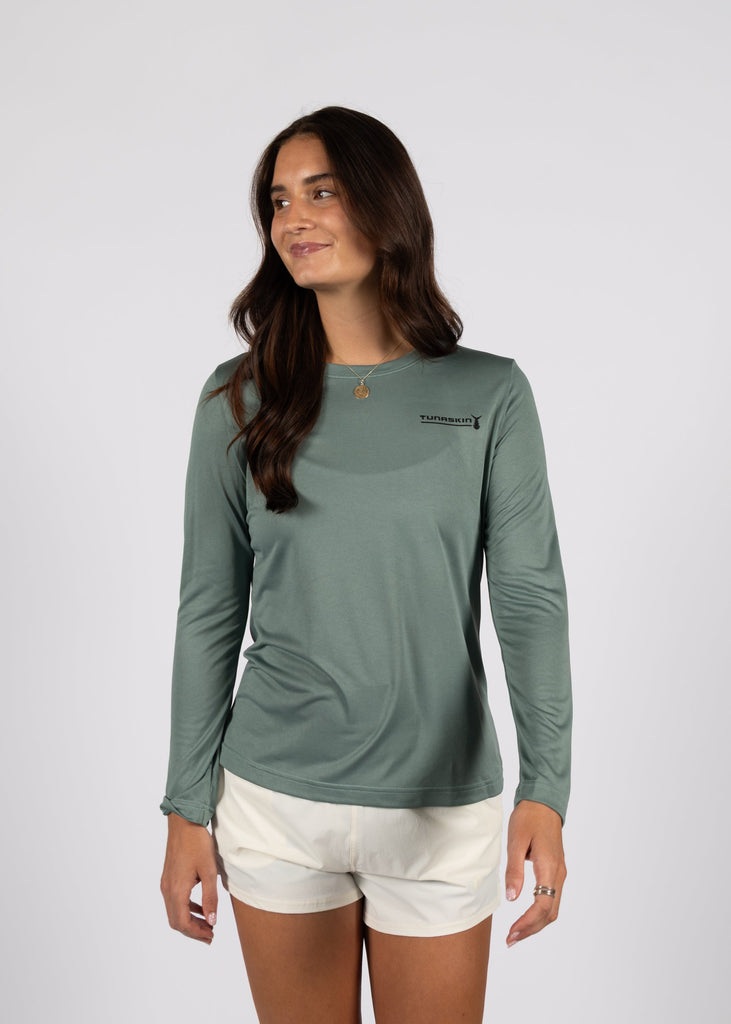 model wearing olive long sleeve shirt with tunaskin left chest logo