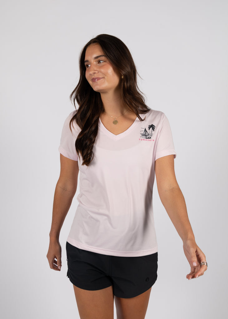 woman wearing flamingo v-neck with left chest logo on white background