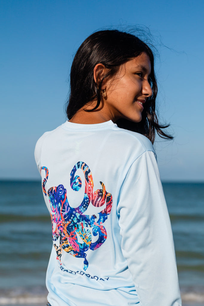 Girl wearing Octopus Tunaskin shirt on beach